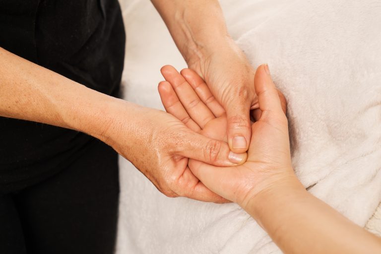 Chiropractic care for lower back pain 2 Physiotherapist performing Manual Therapy Camrose assessment for joint and muscle pain
