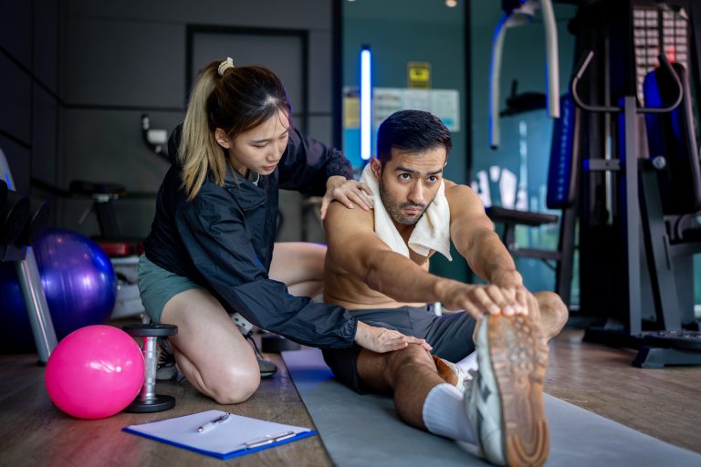 Chiropractic care for lower back pain 5 Therapist guiding exercise therapy during Physiotherapy in Camrose rehabilitation session