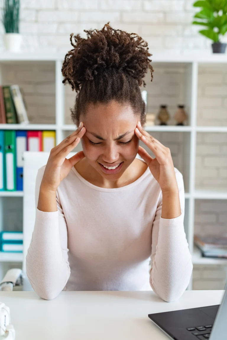 Massage for TMJ and Jaw Pain in Camrose 2 woman experiencing headache